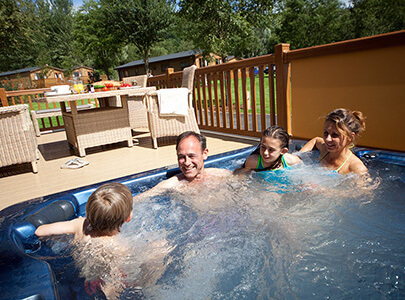 AB Sundecks Picket Panel and Decking with family in Hot Tub
